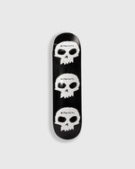 PLEASURES SKULLS SKATE DECK